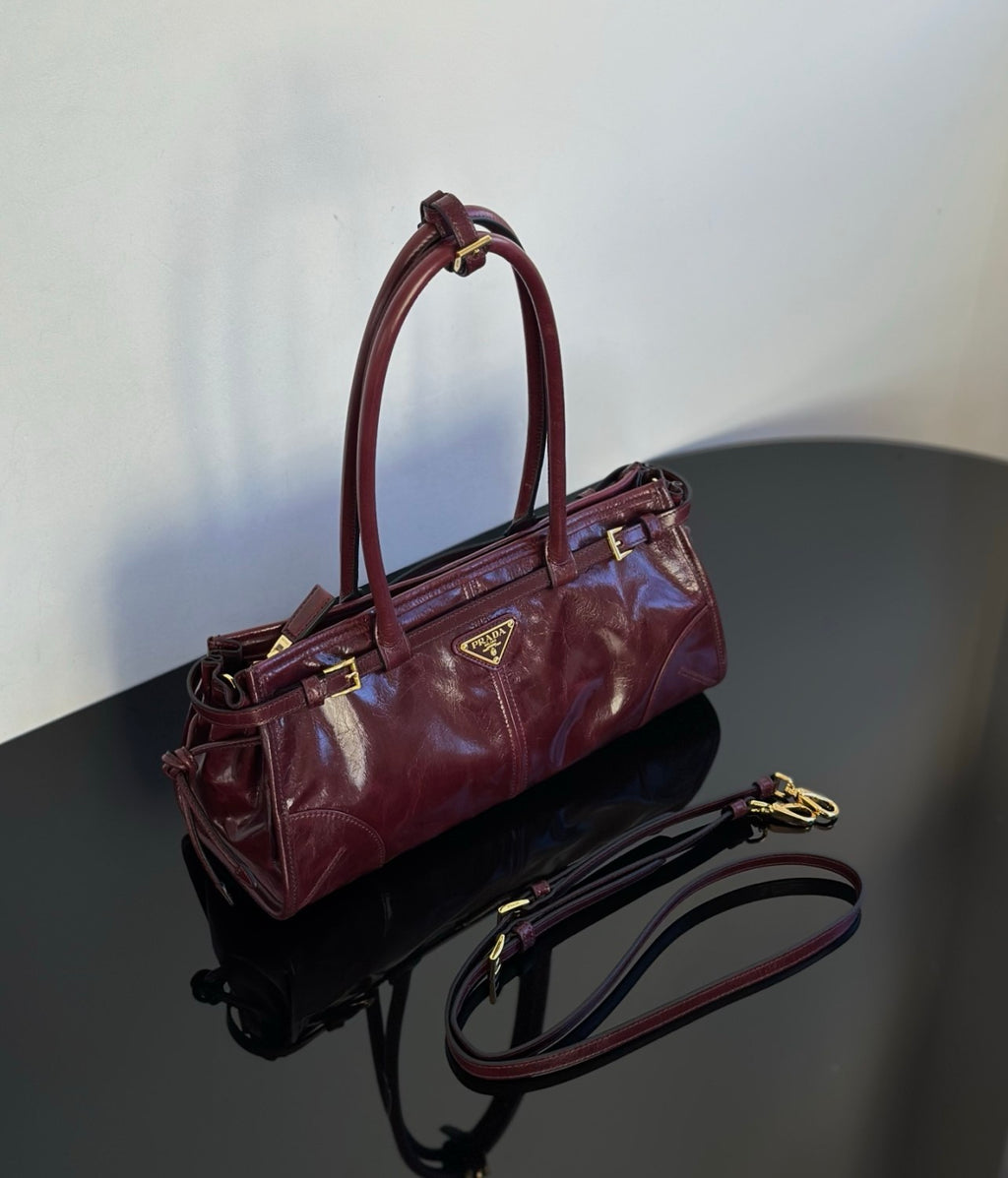 Prada Soft Lux new Bordeaux red motorcycle bag. authentic quality. made of waxed leather. with long handles and a detachable long shoulder strap #83132A