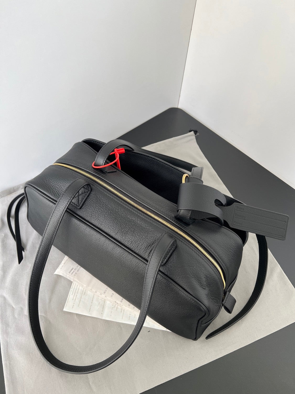 Balenciaga Men's Carrie Black Cowhide Small Bowling Bag with Aged Gold Metallic Accessories Handbag Bags #76257