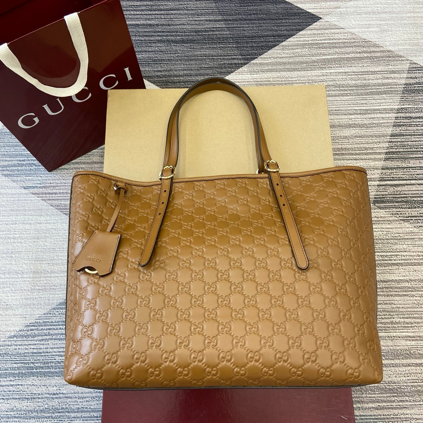 Gucci GG Emblem Debossed Leather Tote #335611