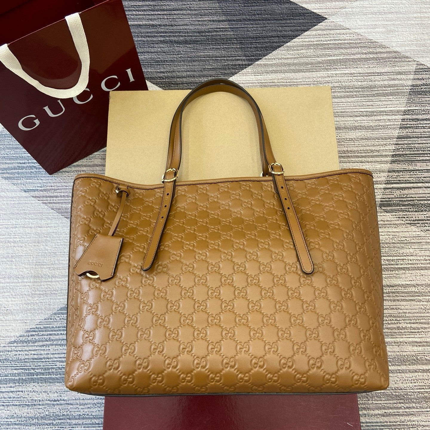 Gucci GG Emblem Debossed Leather Tote #335611