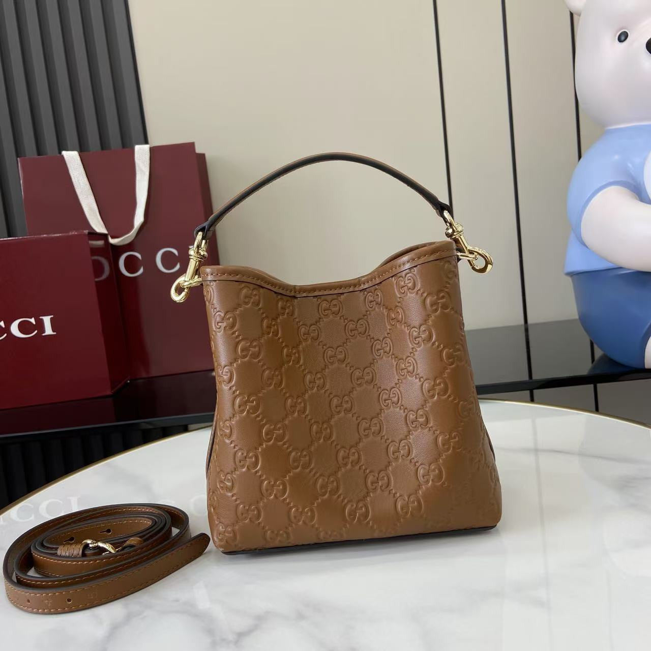 Gucci GG Emblem Small Bucket Bag Trendy Clutch Bag Crossbody Bag Small Size Gold Accents Elegant  #82388A