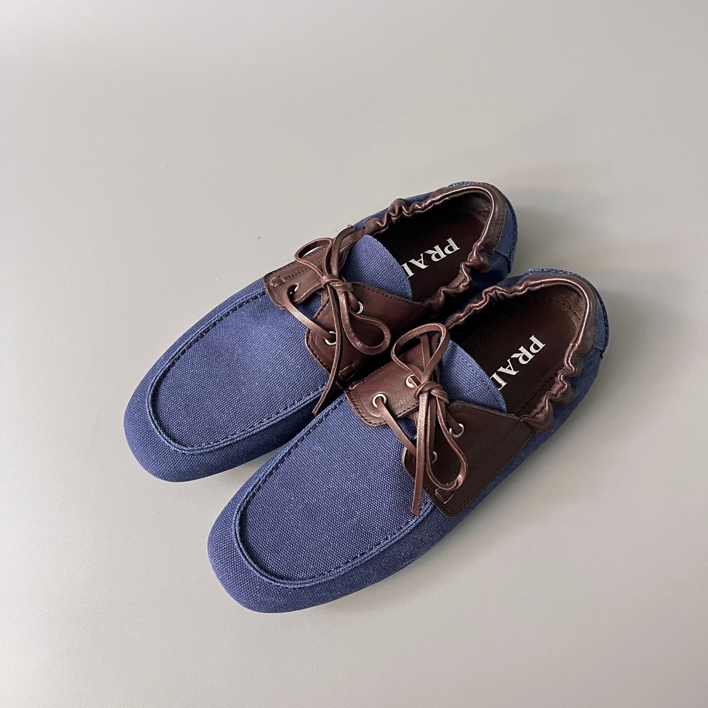 PRADA Shuffle Aged Canvas And Leather Boat Shoes #381722