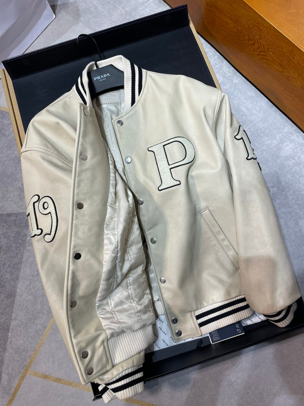 Prada Men's and Women's Spring and Autumn Solid Color Letter Logo Applique Zipper Leather Long Sleeve Jacket #73932