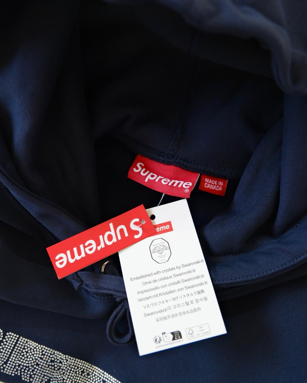 Supreme x Swarovski Men's and Women's FW25 WEEK4 Motion Logo Hooded Sweatshirt rhinestone dynamic logo kangaroo pocket hooded sweatshirt #332326