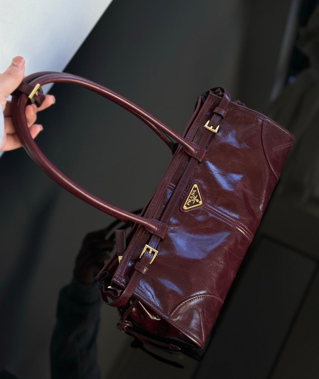 Prada Soft Lux new Bordeaux red motorcycle bag. authentic quality. made of waxed leather. with long handles and a detachable long shoulder strap #83132A