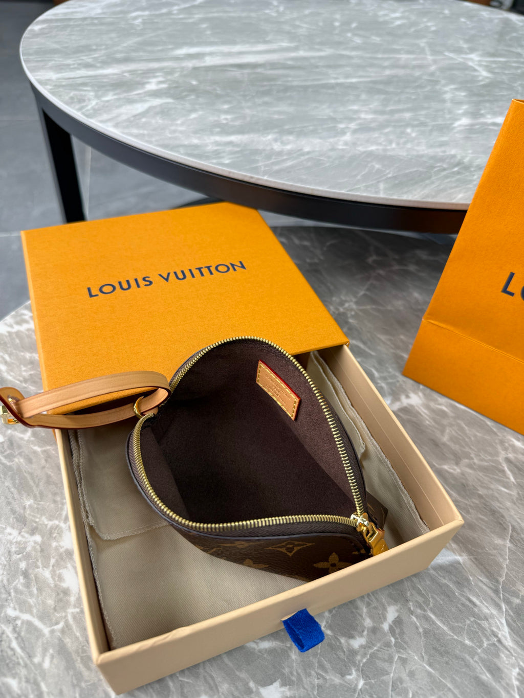 Louis Vuitton New 2026 Cosmetic Wallet Is Compact And Elegant Perfect For Carrying In Your Hand On Your Wrist Or As An Accessory Bag Bags M25653 #197445