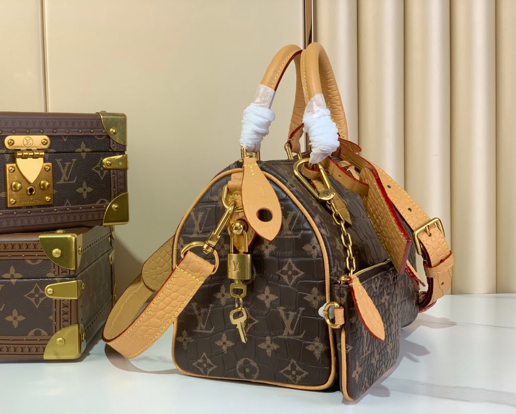 Louis Vuitton Speedy Bandoulière 25 Monogram Leather Handbag Coffee Brown Features Polished Metal Hardware A Lambskin Lining. And An Internal Signature Tag #196001