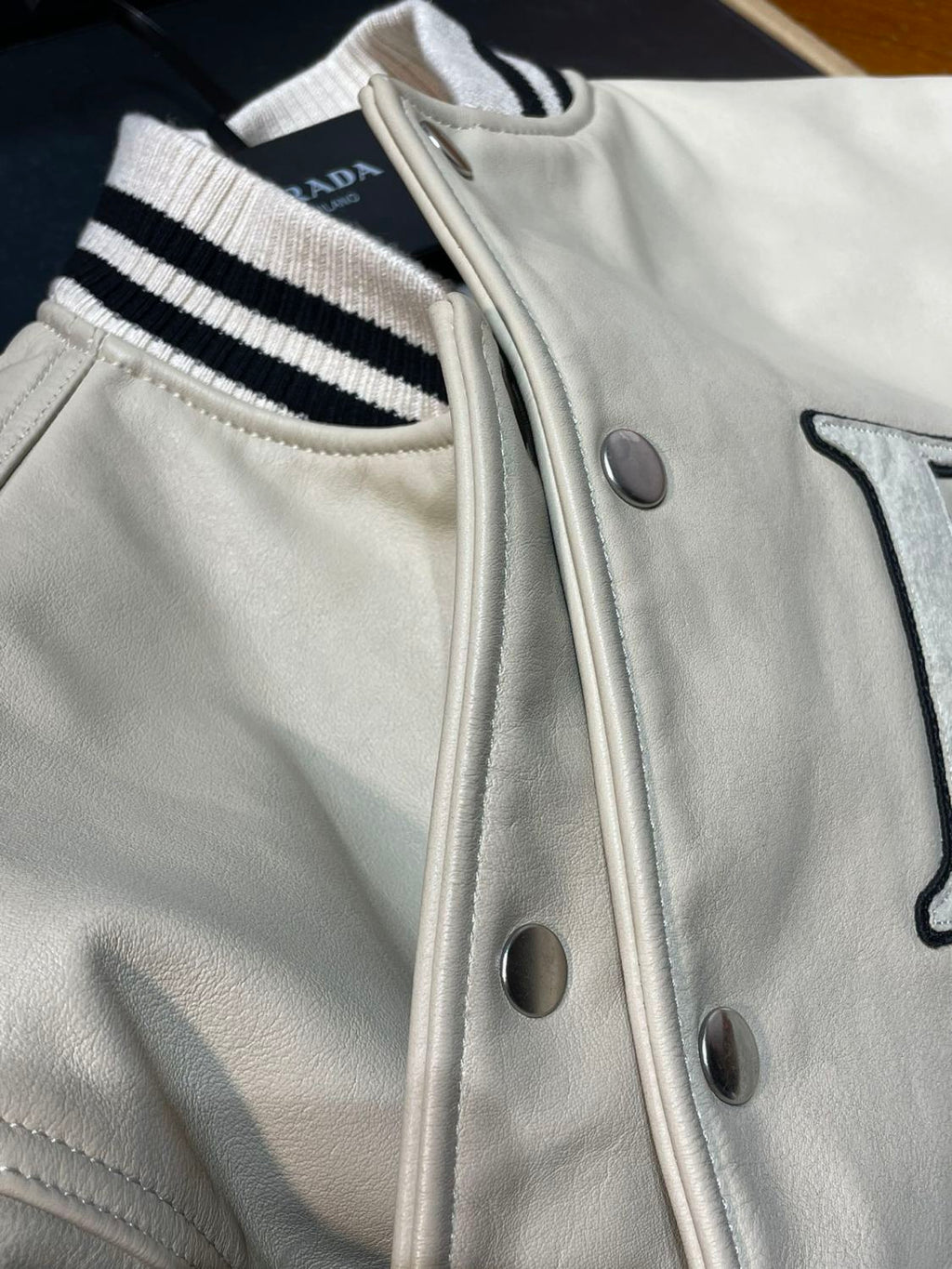 Prada Men's and Women's Spring and Autumn Solid Color Letter Logo Applique Zipper Leather Long Sleeve Jacket #73932