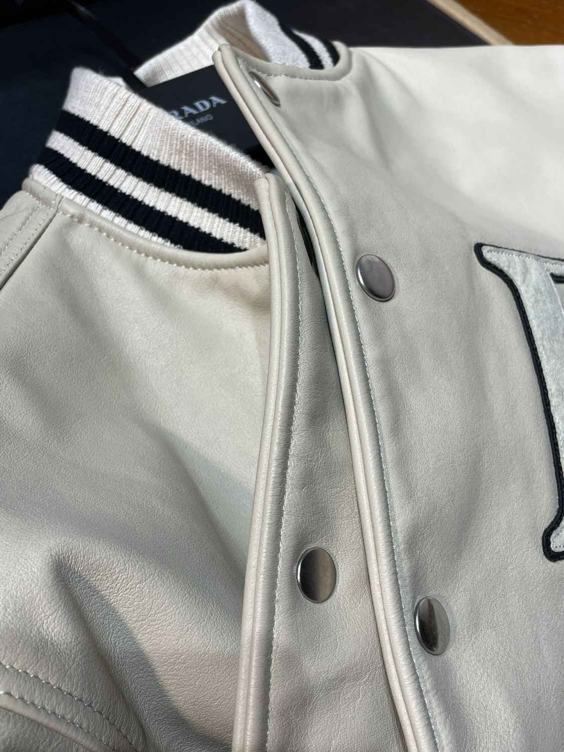 Prada Men's and Women's Spring and Autumn Solid Color Letter Logo Applique Zipper Leather Long Sleeve Jacket #73932